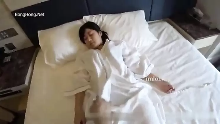 Japanese young couple in hotel room