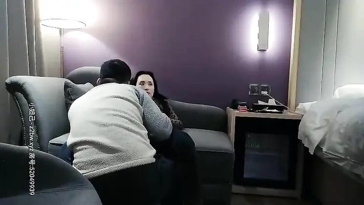 Young woman with long legs in jeans passionately licks and licks up close shot