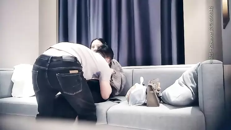 Young woman with fleshy body slaps into the sofa while standing on the sofa