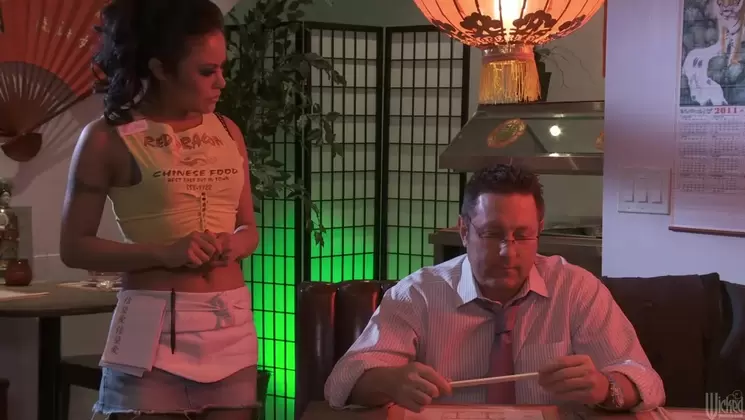Two waitresses and a guest